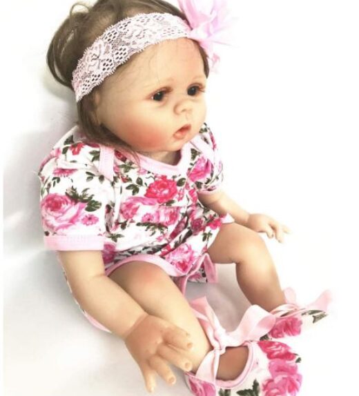 Reborn doll clothes - Sitting reborn girl in pink rose pattern bodysuit